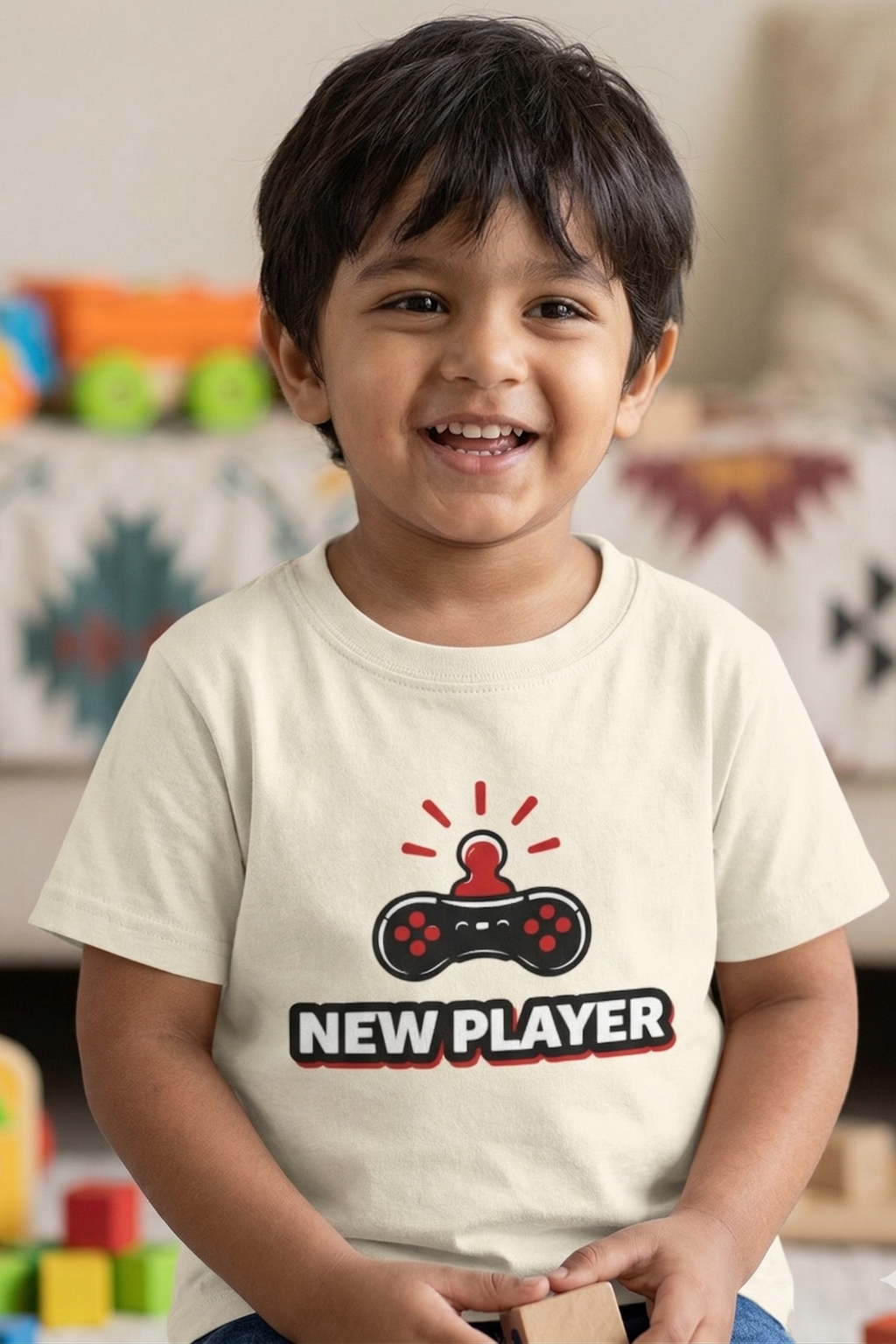 Child wearing a t-shirt with 'NEW PLAYER' design in a room with toys.